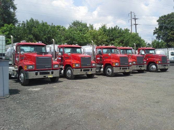 Lee Transport fleet of red Mack trucks