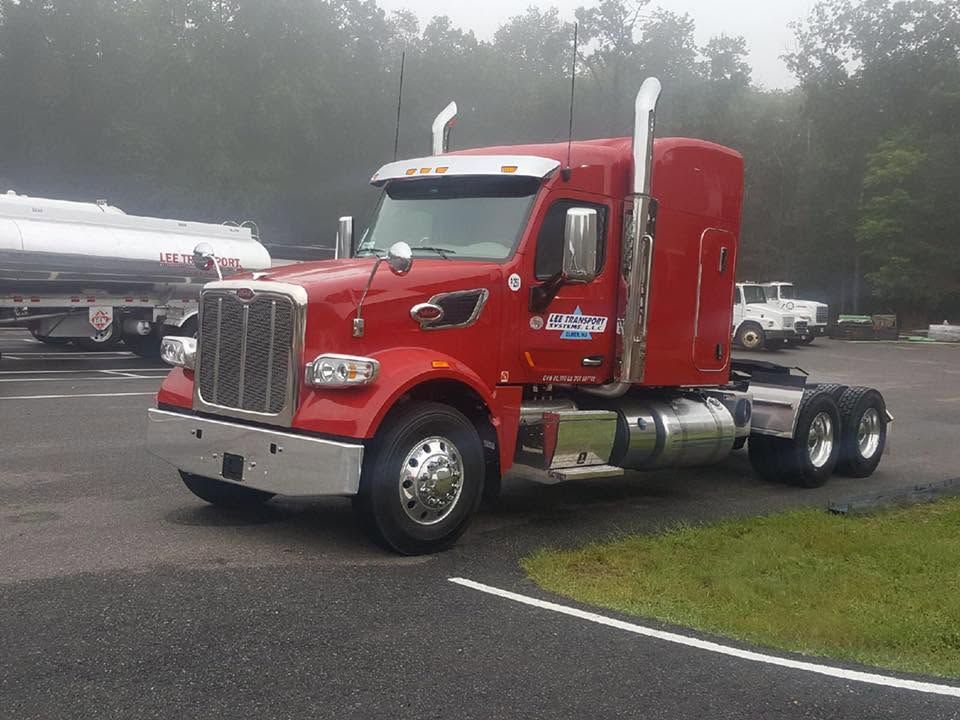Red Peterbilt sleeper truck in foggy morning